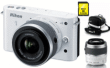 Nikon 1 J2 Blanc Laqué + 2 Obj. 1 Nikkor CX VR 10 - 30 mm f/ 3.5 - 5.6 + 30 - 110 mm f/3.8 - 5.6 + Fourre-tout + SDHC 8 Go